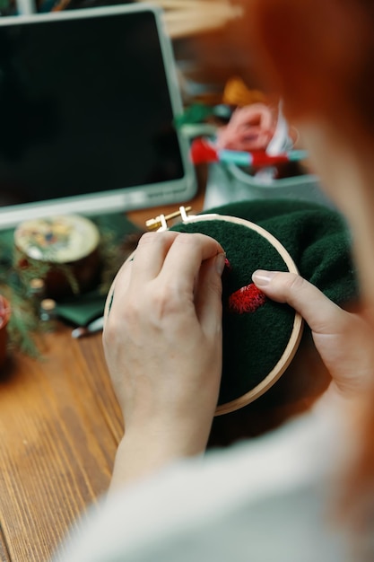 Artist working on embroidery